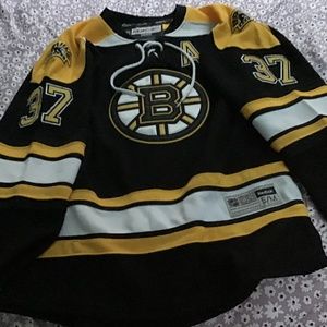 Official license NHL Boston Bruins Jersey #37 Bergeron Size Small.